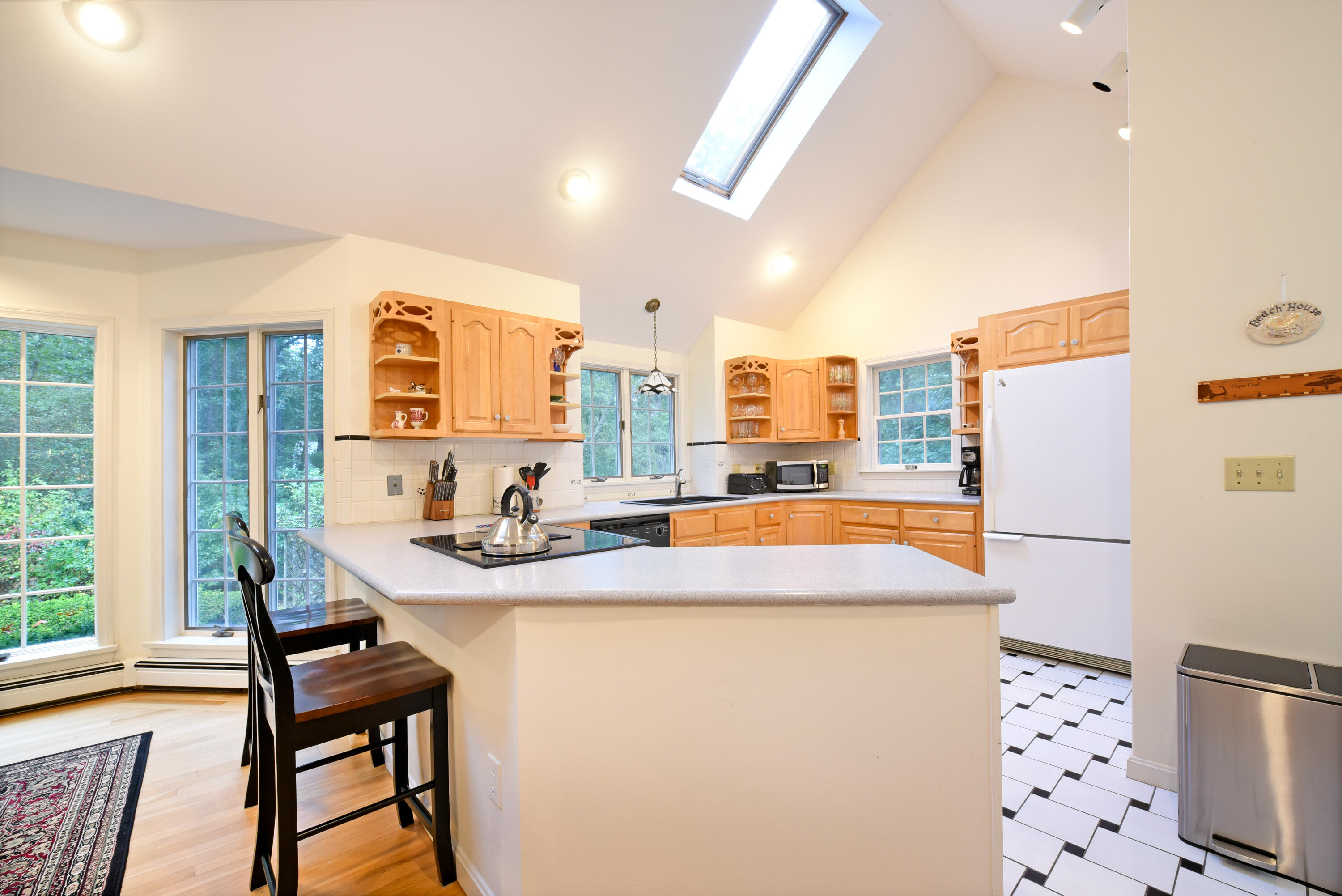 7 Captain Scott Road Harwich, MA 02645 - Photo 23 of 41 a room with furniture a large window and a refrigerator