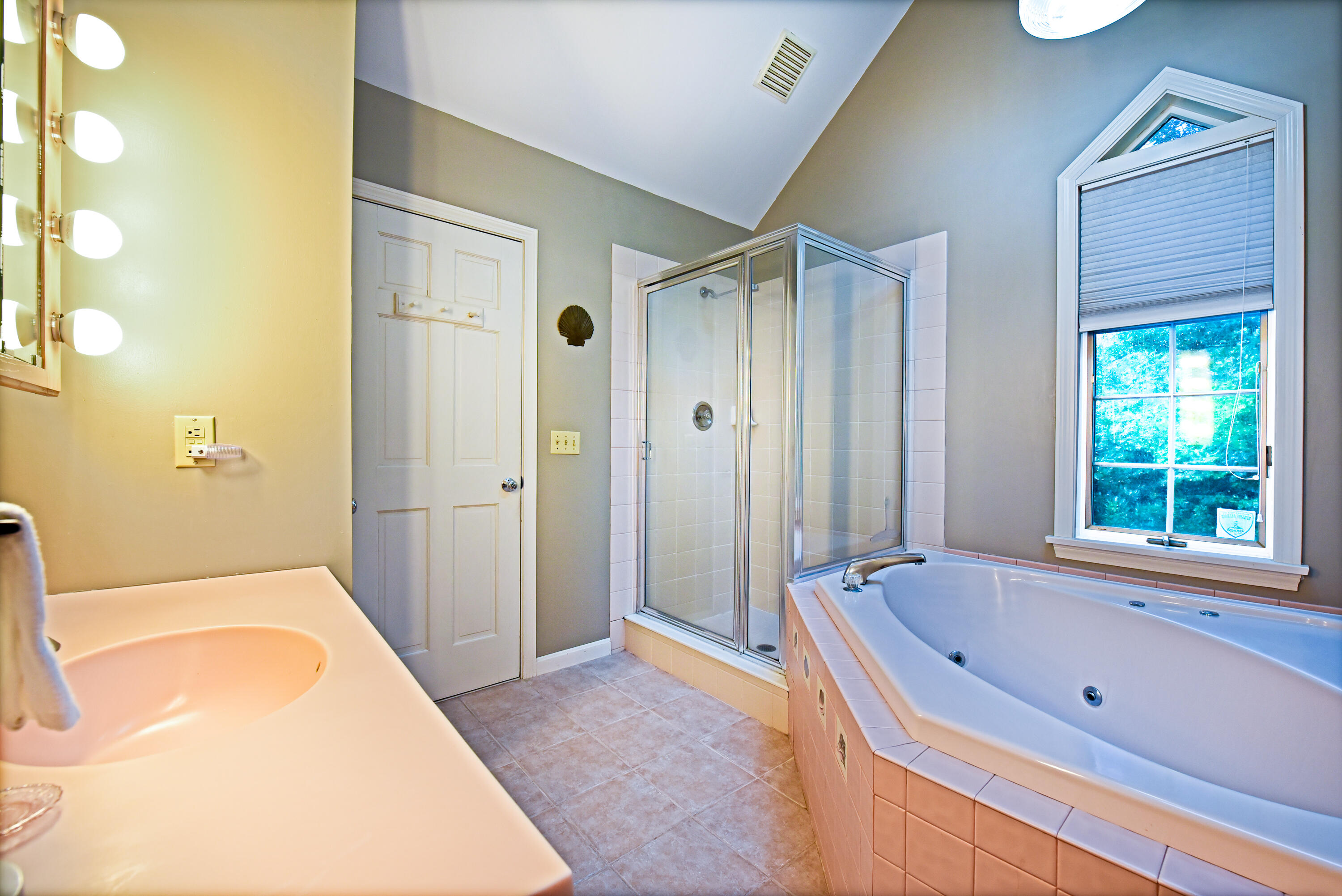 7 Captain Scott Road Harwich, MA 02645 - Photo 30 of 41 a bathroom with a tub a sink and a large mirror