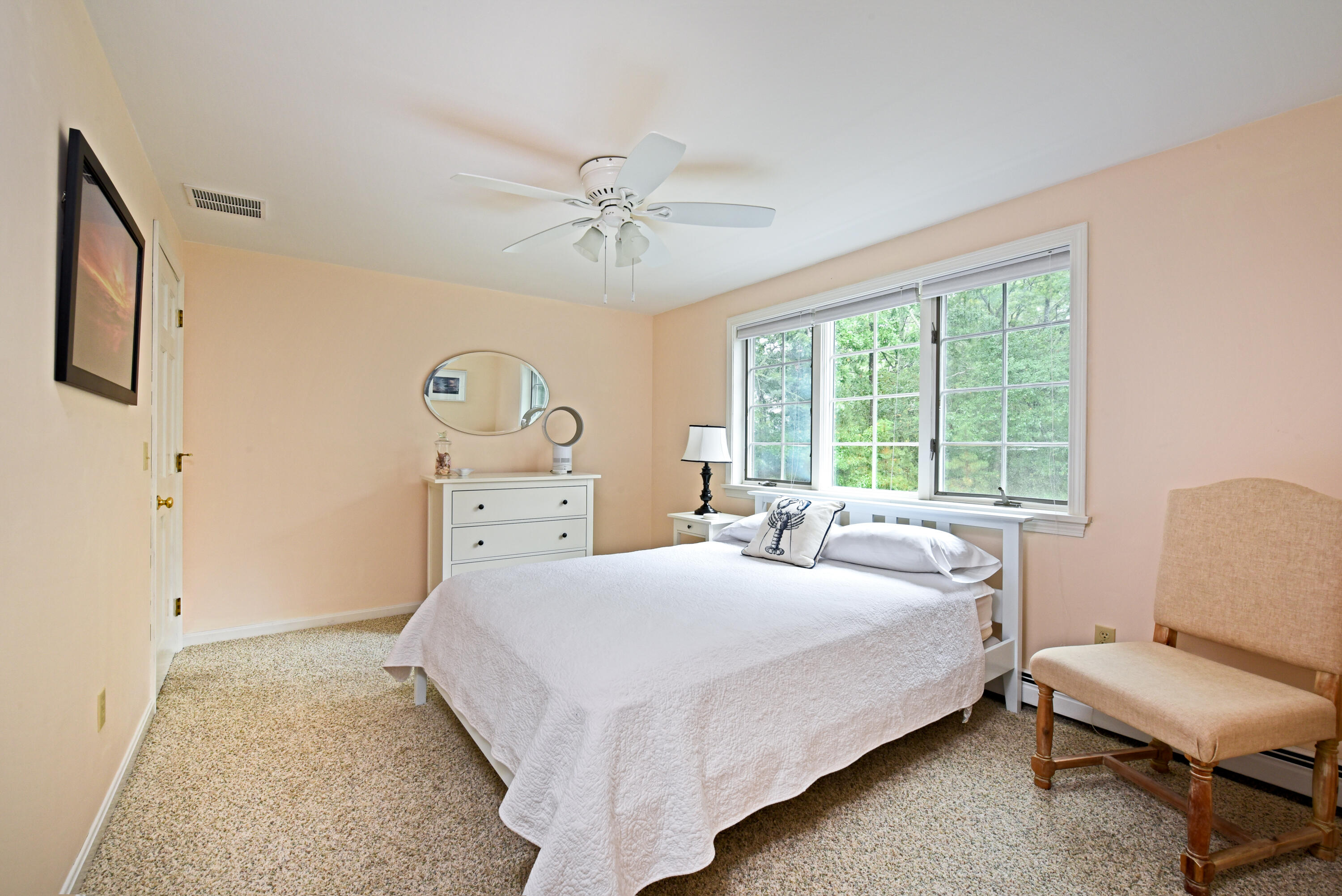 7 Captain Scott Road Harwich, MA 02645 - Photo 35 of 41 a bedroom with a bed and a chair
