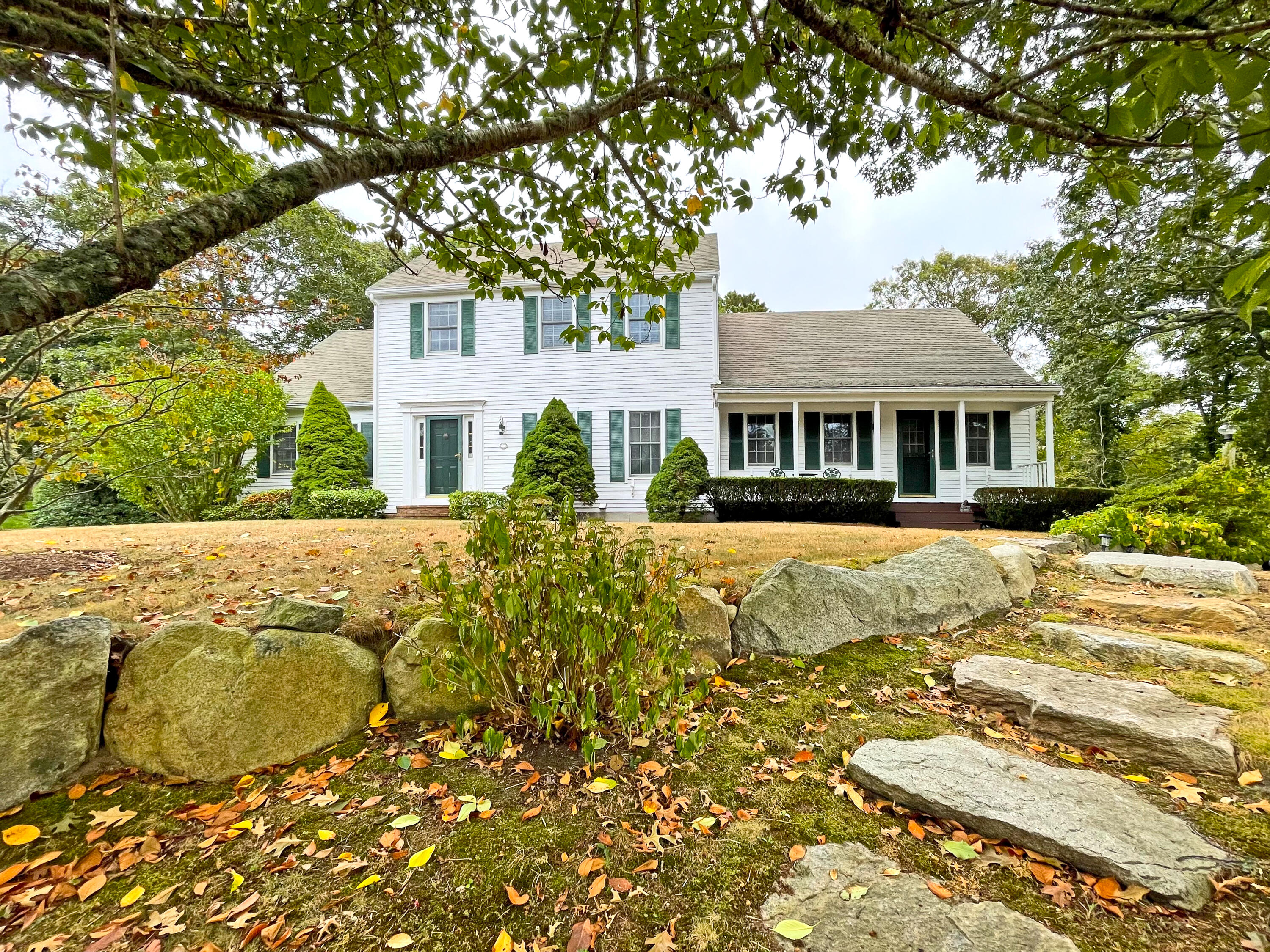 7 Captain Scott Road Harwich, MA 02645 - Photo 5 of 41 a front view of a house with a yard