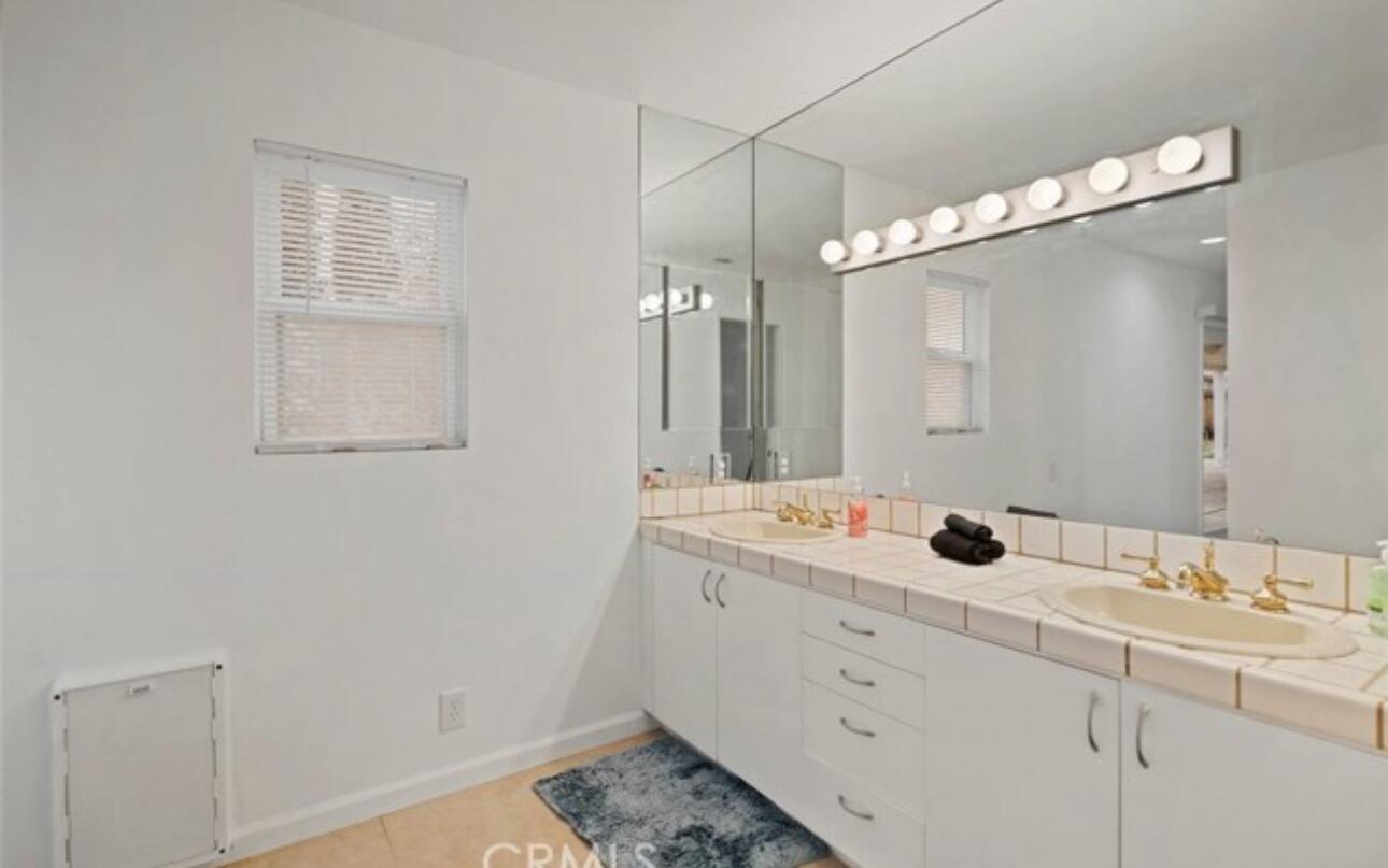 8564 Taft Court Yucca Valley, CA 92284 - Photo 14 of 25 a bathroom with a sink and a mirror