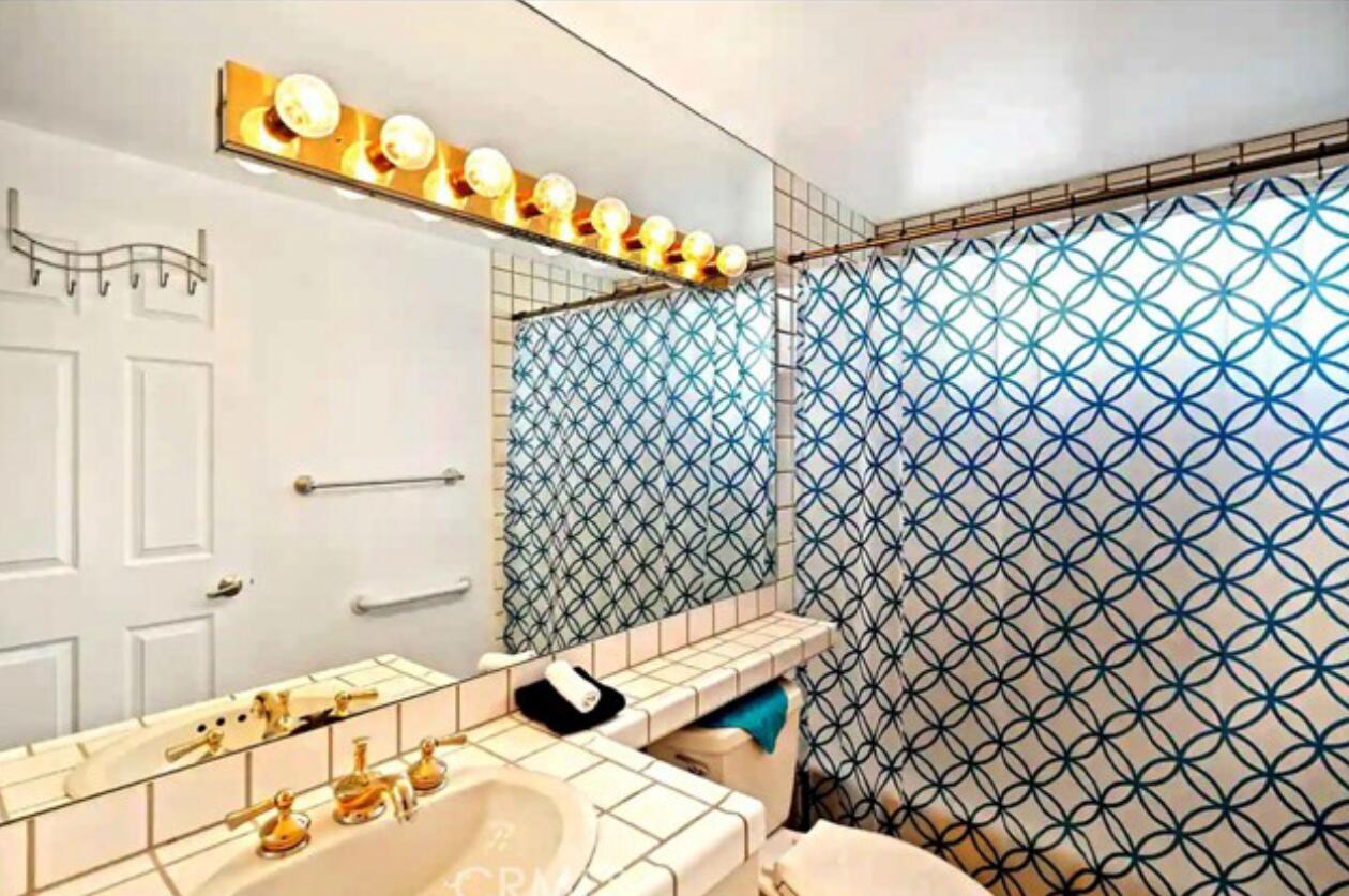 8564 Taft Court Yucca Valley, CA 92284 - Photo 19 of 25 a bathroom with a sink and a mirror