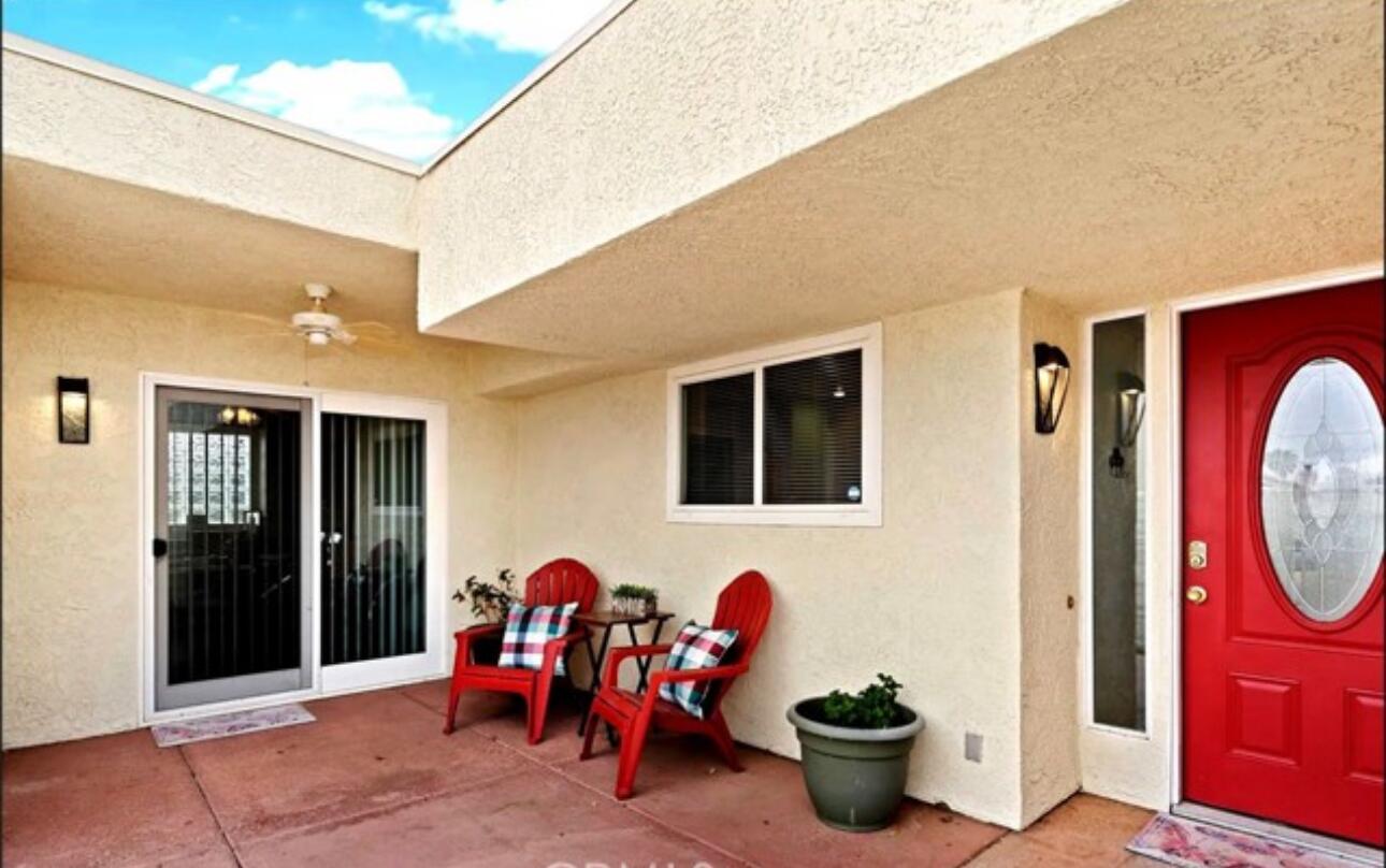 8564 Taft Court Yucca Valley, CA 92284 - Photo 2 of 25 a group of people sitting in patio of a house