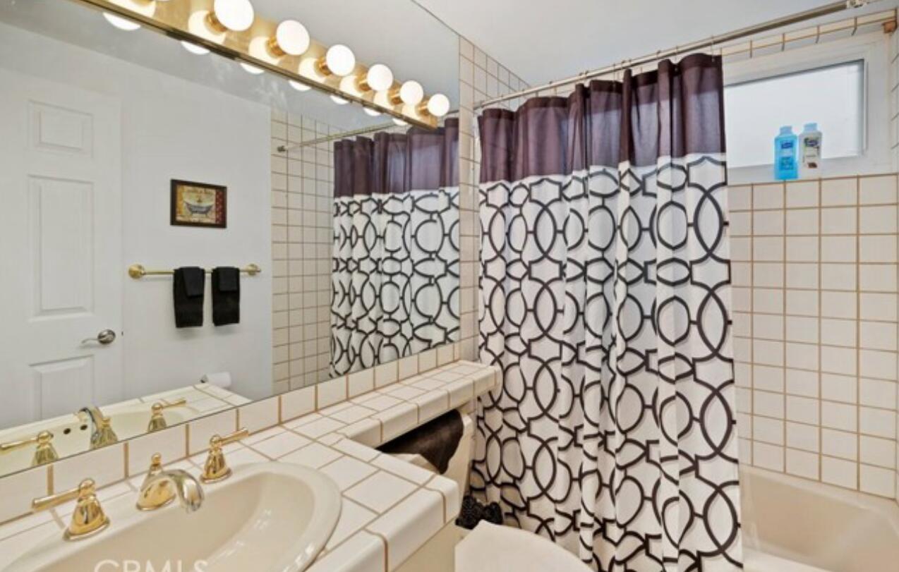 8564 Taft Court Yucca Valley, CA 92284 - Photo 22 of 25 a bathroom with a sink and a mirror