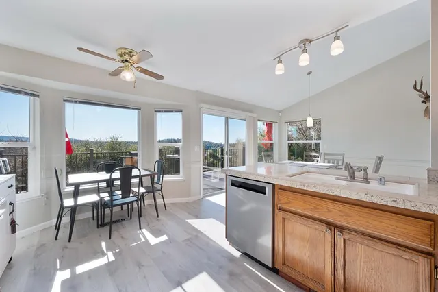 a view of a dining room with furniture window and outside view
