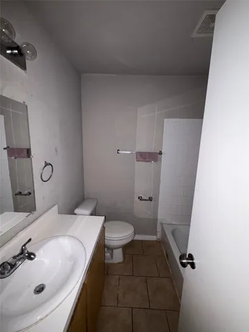 a bathroom with a sink and toilet