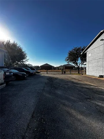 a view of road with view of car parked
