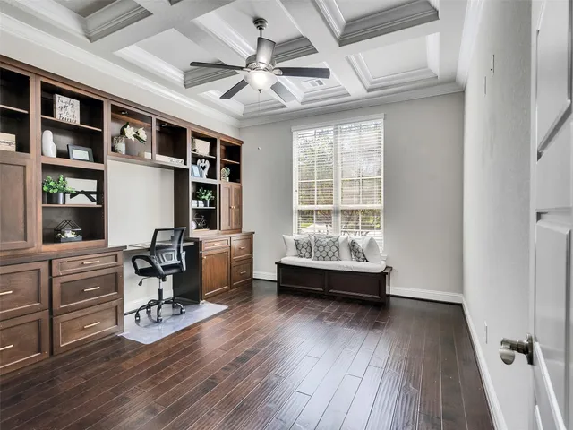 a view of workspace with wooden floor and furniture
