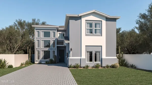 a front view of a house with a yard and trees