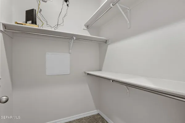 a view of a room with racks on the wall