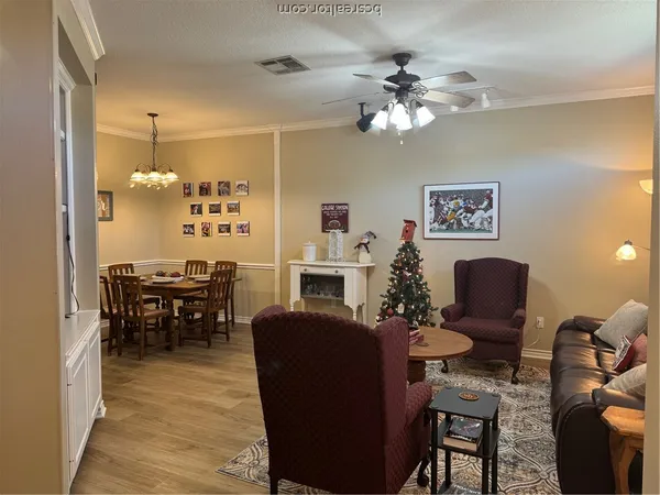 a kitchen with a refrigerator and a stove top oven