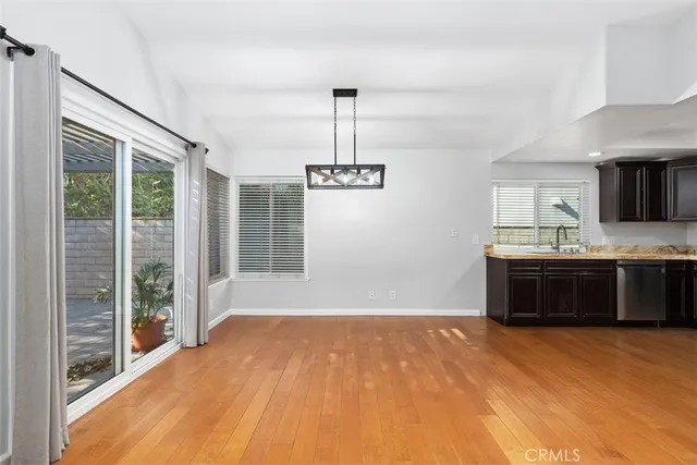 a large kitchen with stainless steel appliances granite countertop a sink cabinets and stainless steel appliances