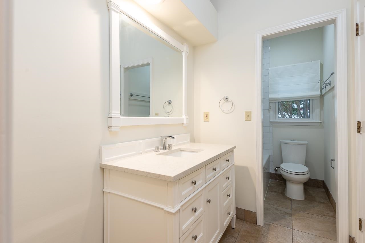 759 West Powell Road Collierville, TN 38017 - Photo 16 of 39 a bathroom with a toilet sink and mirror