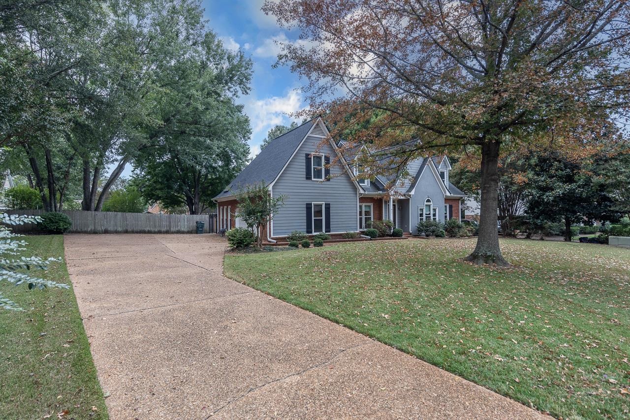 759 West Powell Road Collierville, TN 38017 - Photo 2 of 39 a front view of a house with a yard and tree