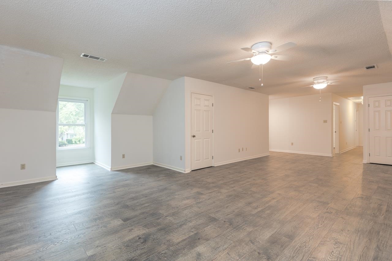 759 West Powell Road Collierville, TN 38017 - Photo 27 of 39 an empty room with chandelier fan and windows