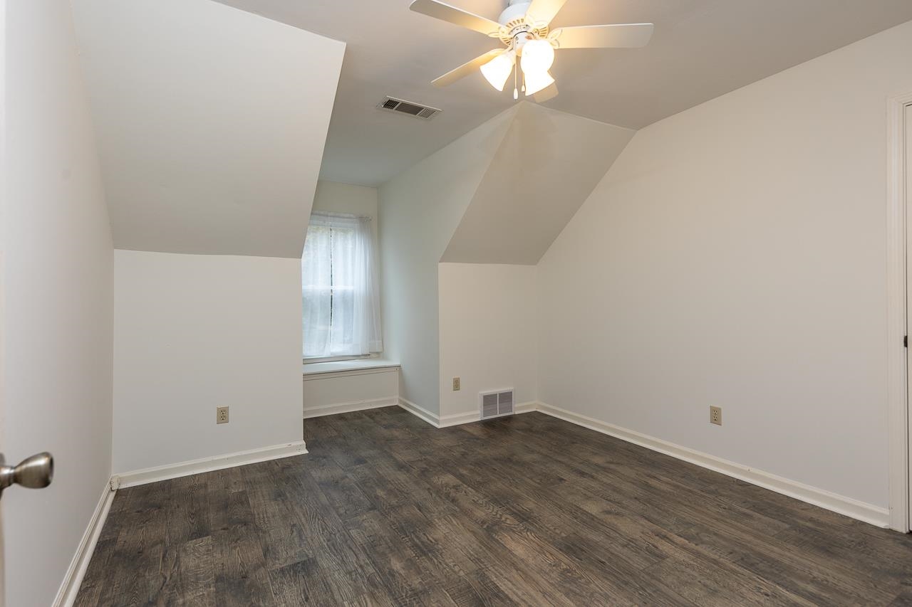 759 West Powell Road Collierville, TN 38017 - Photo 28 of 39 an empty room with wooden floor and fan