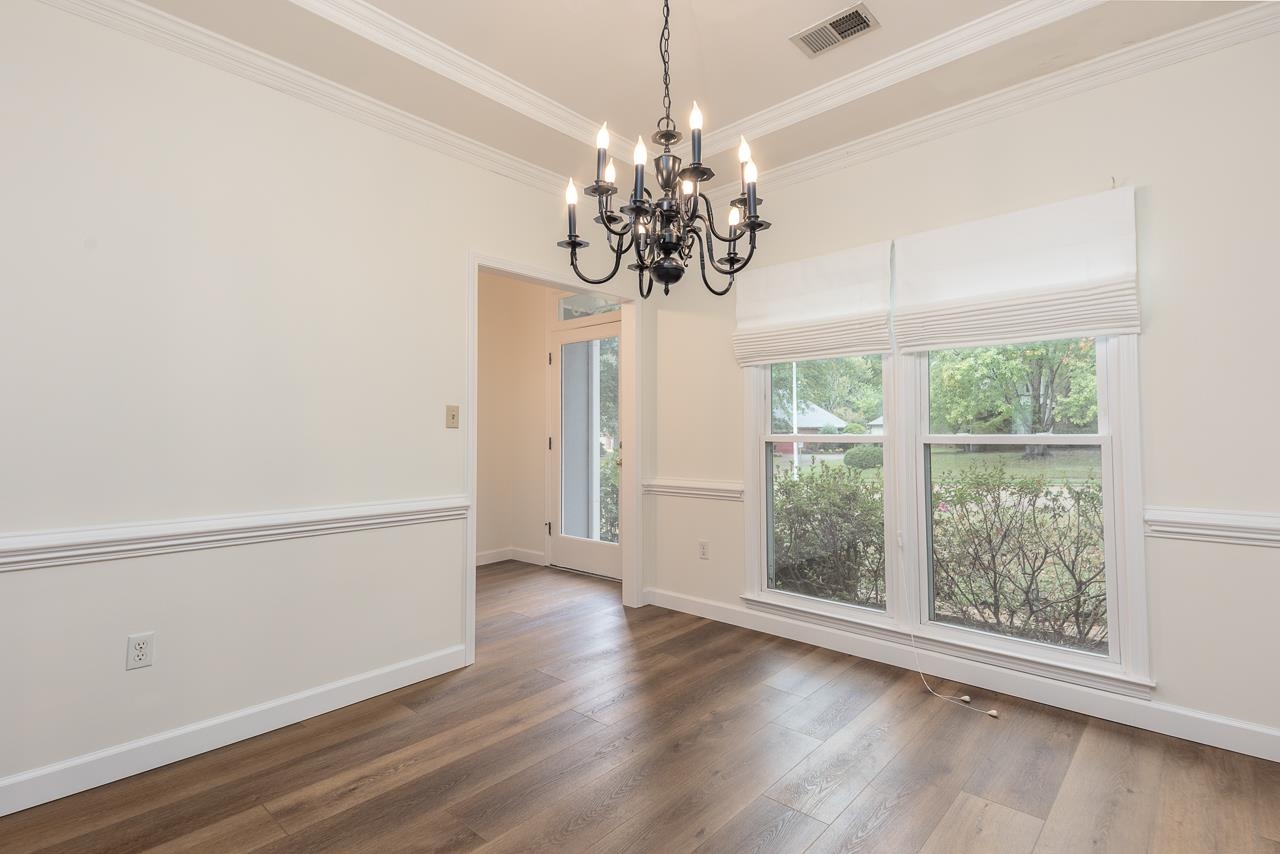 759 West Powell Road Collierville, TN 38017 - Photo 6 of 39 a view of a room with wooden floor and chandelier