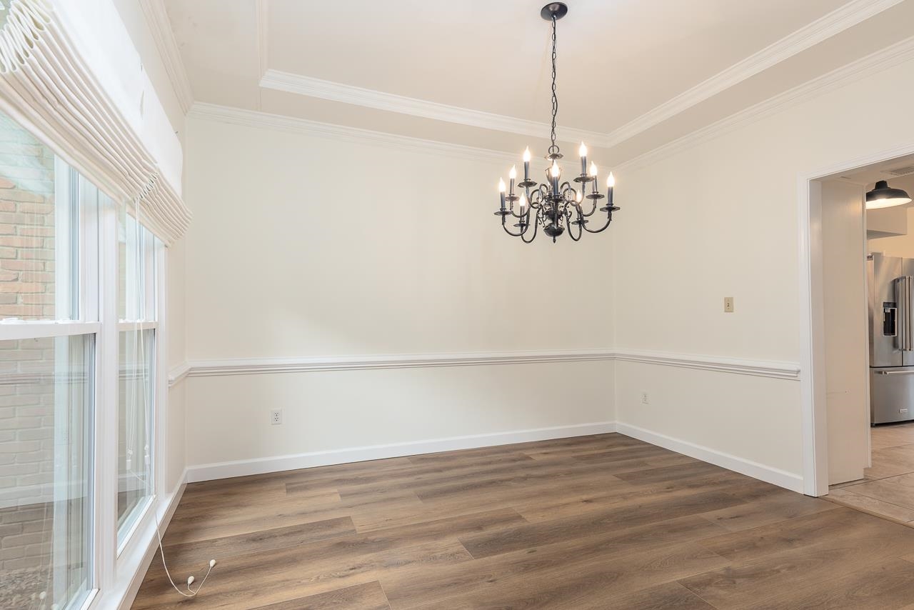 759 West Powell Road Collierville, TN 38017 - Photo 7 of 39 a view of a chandelier in an empty room