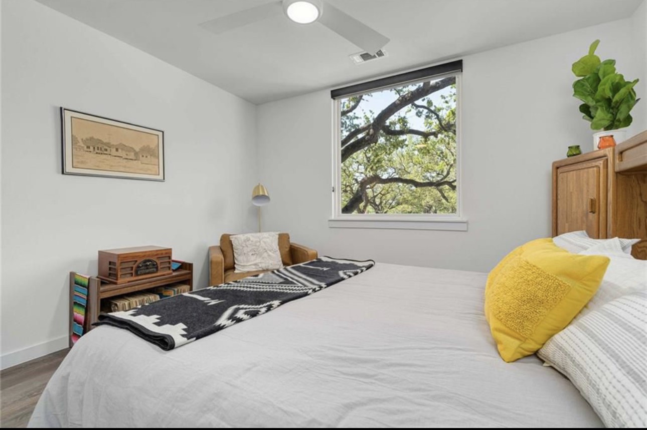 900 South 1st Street, Unit 304 Austin, TX 78704 - Photo 13 of 22 a bedroom with a bed and a window