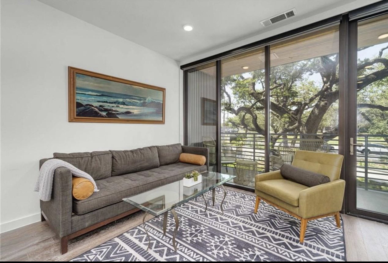 900 South 1st Street, Unit 304 Austin, TX 78704 - Photo 4 of 22 a living room with furniture and a large window