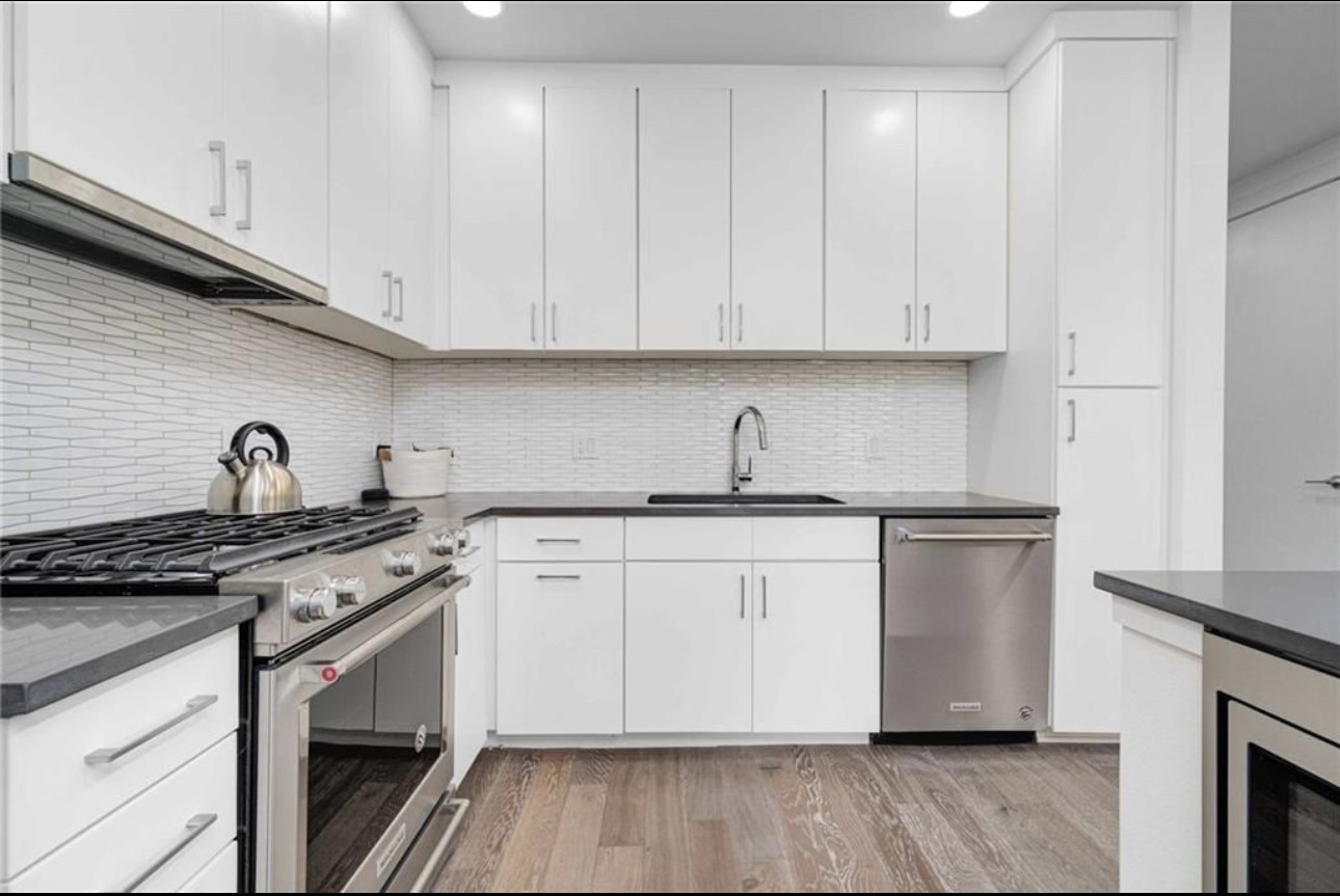 900 South 1st Street, Unit 304 Austin, TX 78704 - Photo 9 of 22 a kitchen with stainless steel appliances granite countertop a stove sink and cabinets