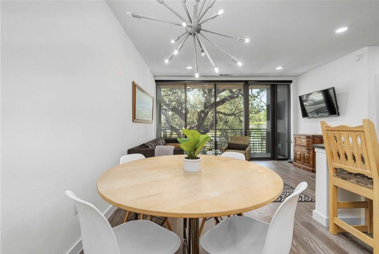 900 South 1st Street, Unit 304 Austin, TX 78704 - Photo 10 of 22 a view of a dining room with furniture window and outside view
