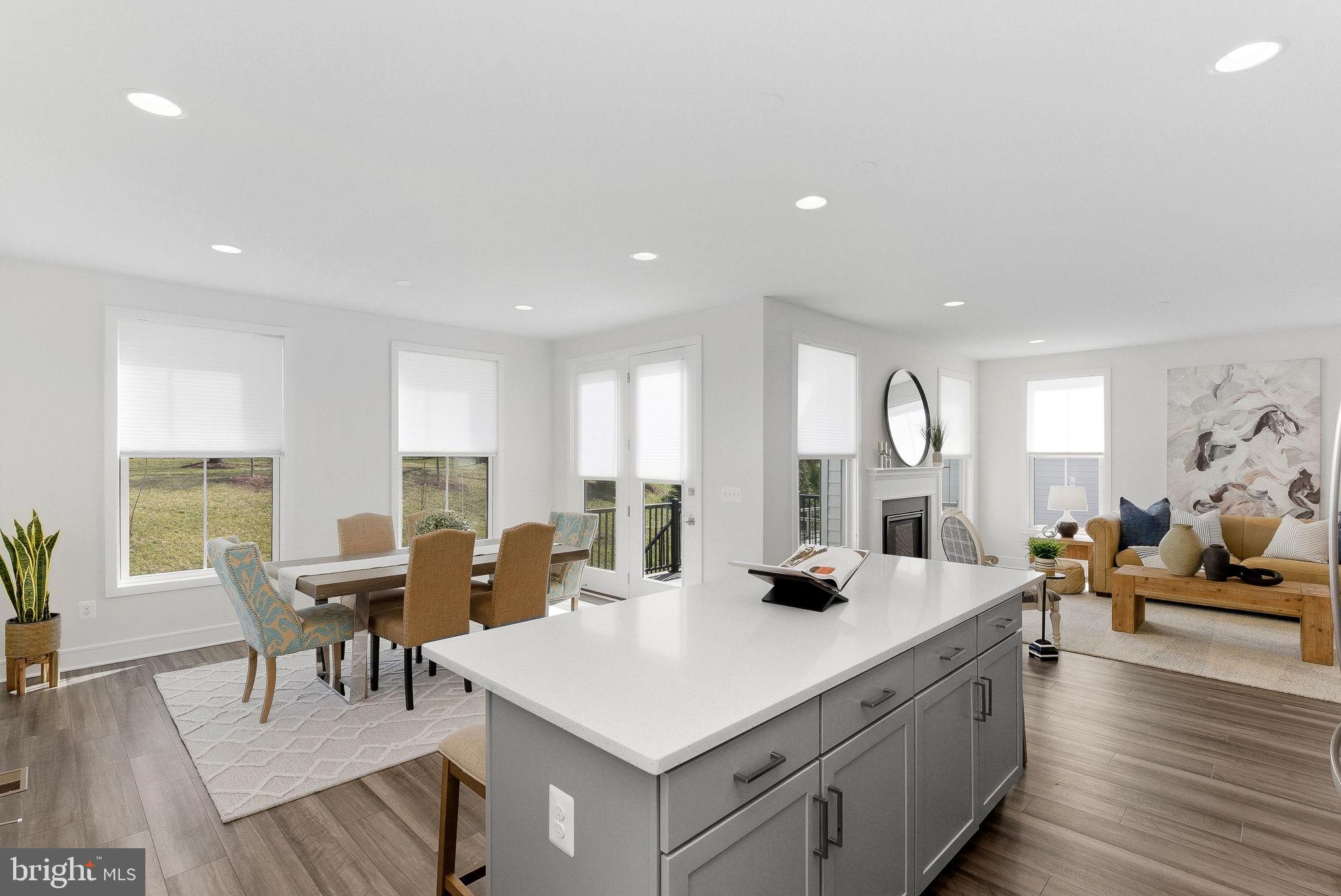 21340 Rainier Lane Broadlands, VA 20148 - Photo 15 of 62 a view of a dining room with furniture and wooden floor