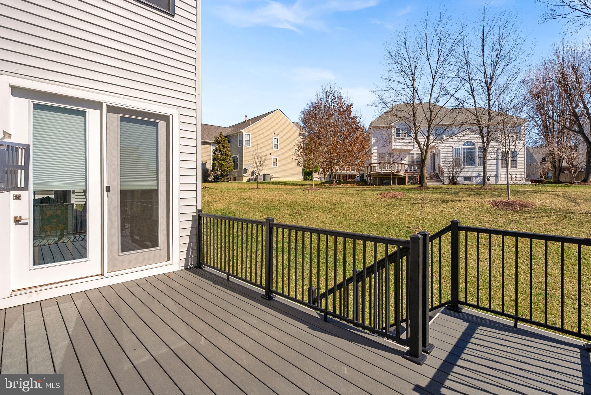 21340 Rainier Lane Broadlands, VA 20148 - Photo 16 of 62 a view of a wooden deck with large trees