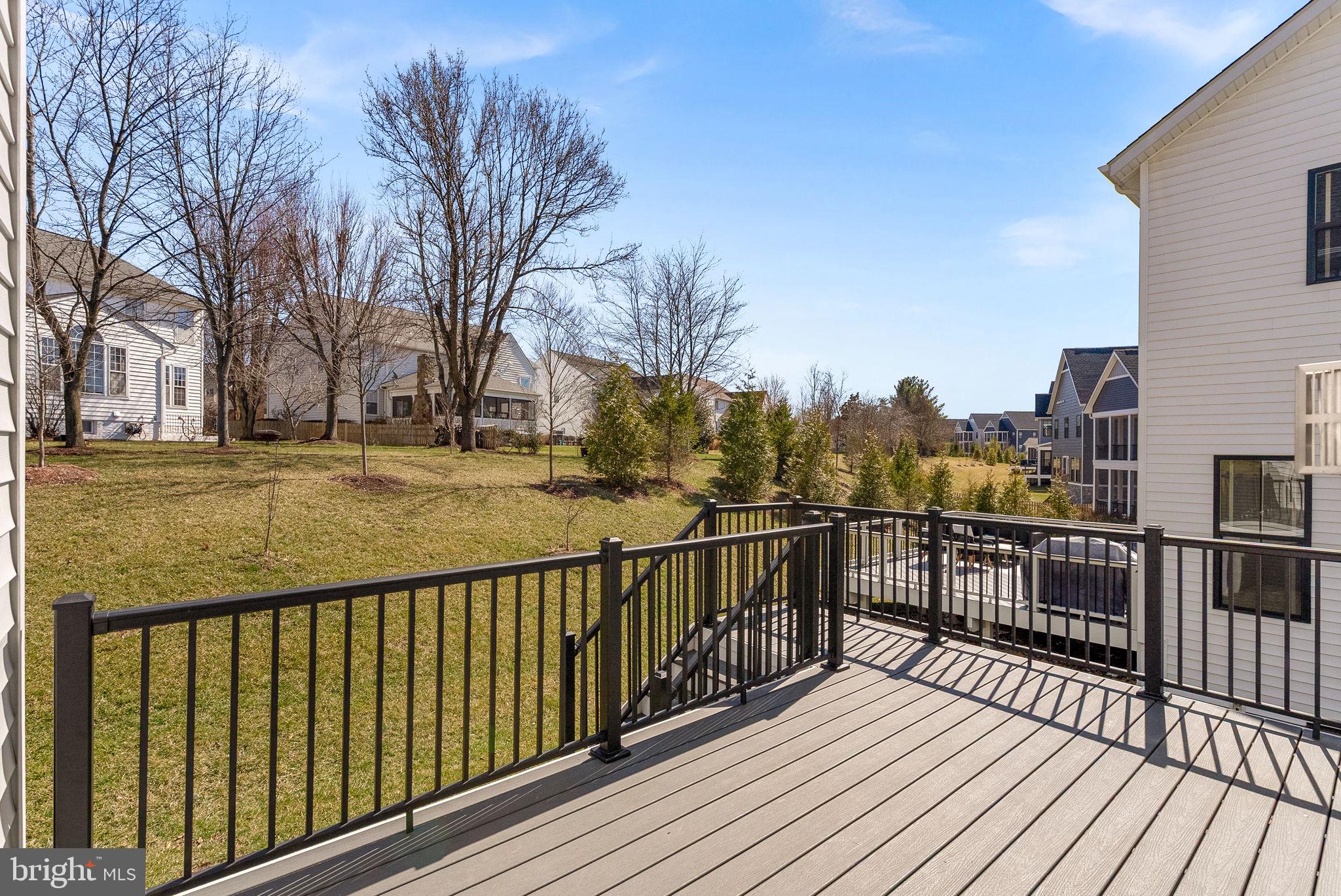 21340 Rainier Lane Broadlands, VA 20148 - Photo 17 of 62 a view of a balcony with wooden floor and fence