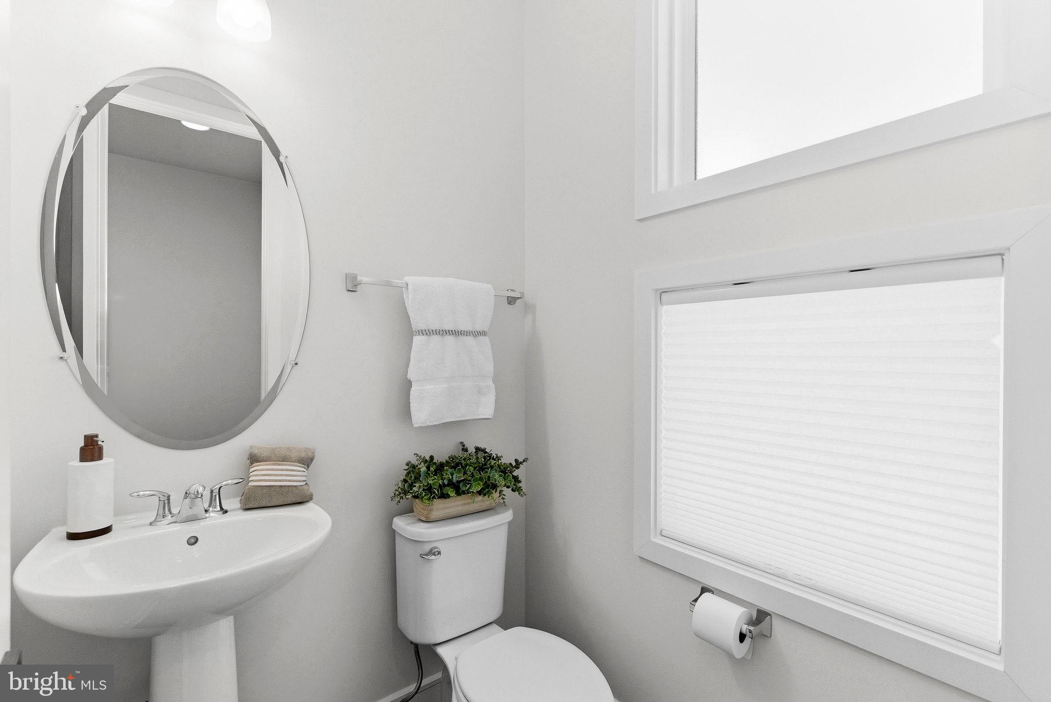 21340 Rainier Lane Broadlands, VA 20148 - Photo 19 of 62 a bathroom with a toilet sink and mirror