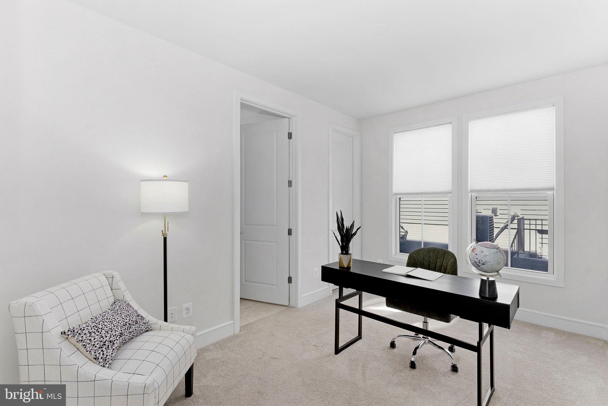 21340 Rainier Lane Broadlands, VA 20148 - Photo 20 of 62 a living room with furniture and a lamp