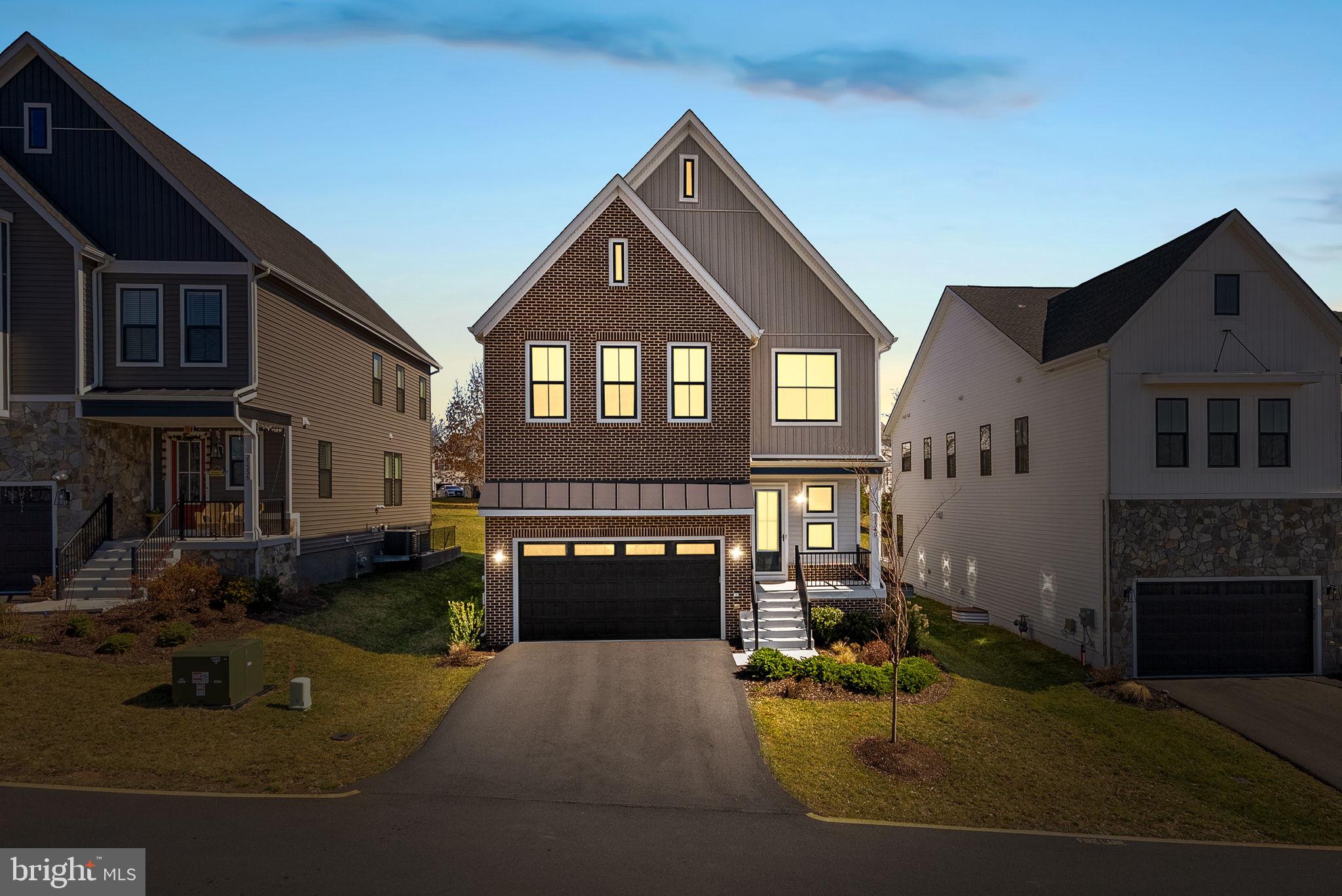 21340 Rainier Lane Broadlands, VA 20148 - Photo 2 of 62 a front view of a house with a yard