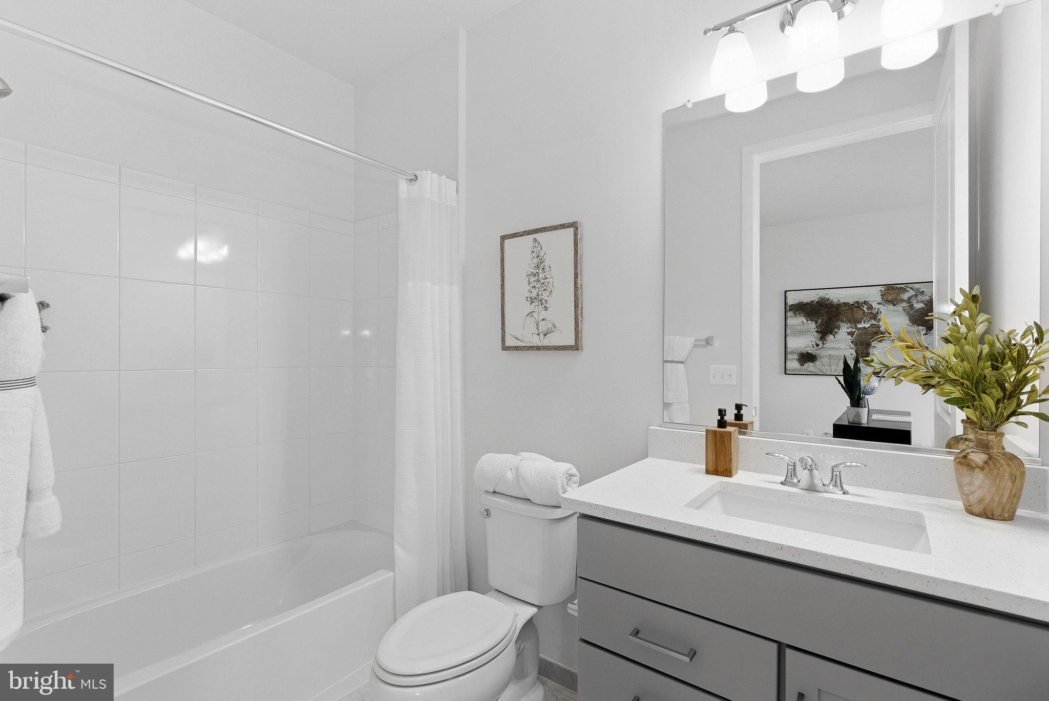 21340 Rainier Lane Broadlands, VA 20148 - Photo 22 of 62 a bathroom with a sink a toilet and shower