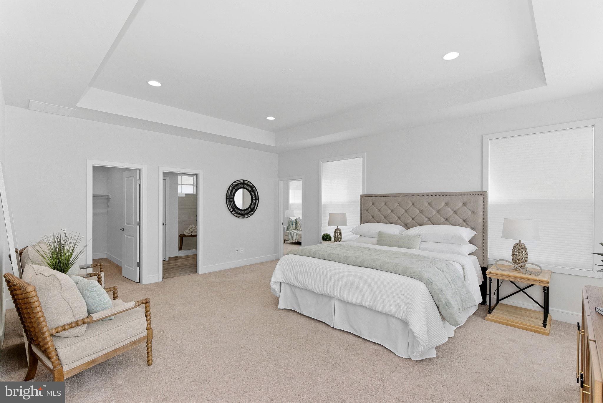 21340 Rainier Lane Broadlands, VA 20148 - Photo 23 of 62 a bedroom with a bed and a couch