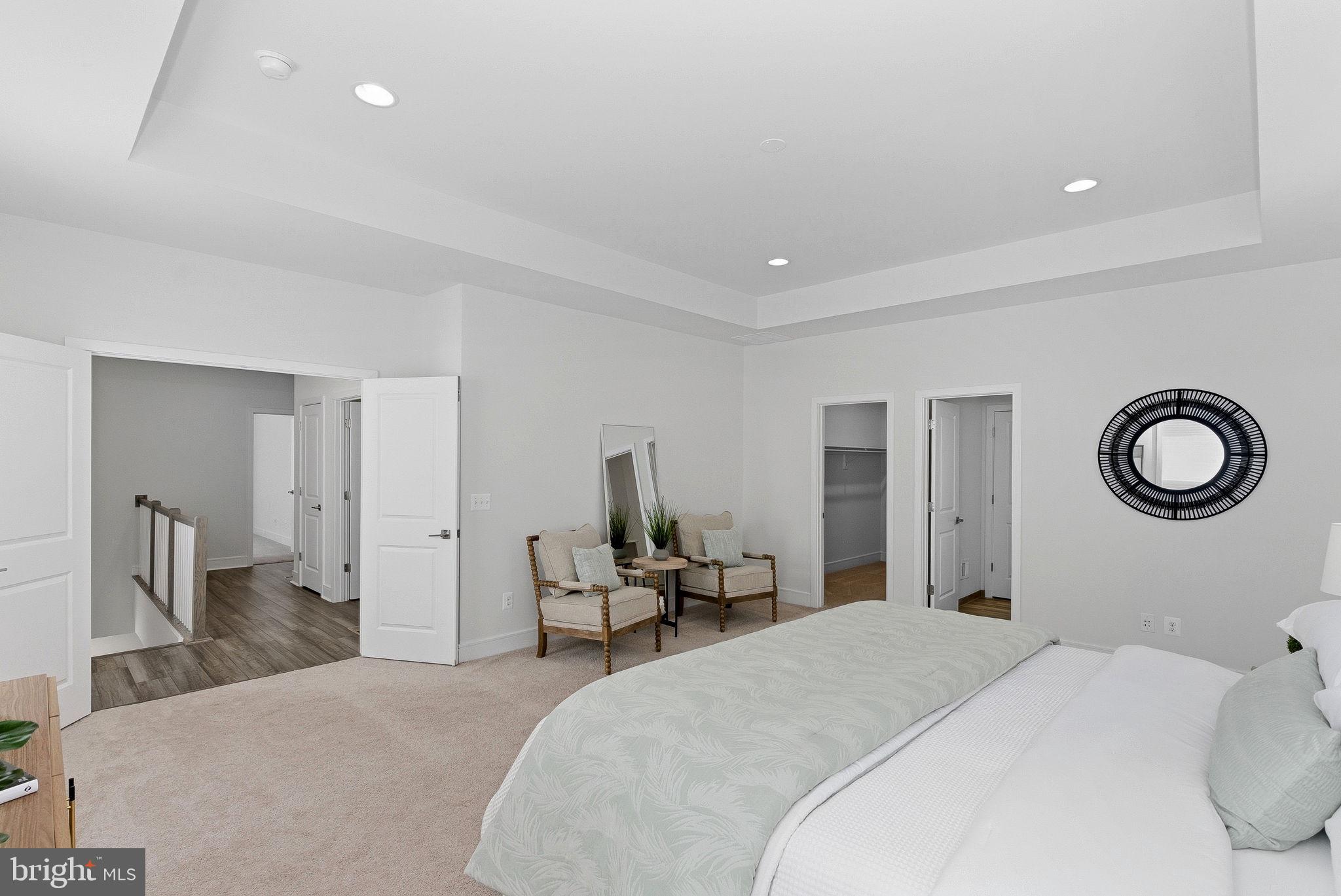 21340 Rainier Lane Broadlands, VA 20148 - Photo 24 of 62 a bedroom with a bed and a cabinets