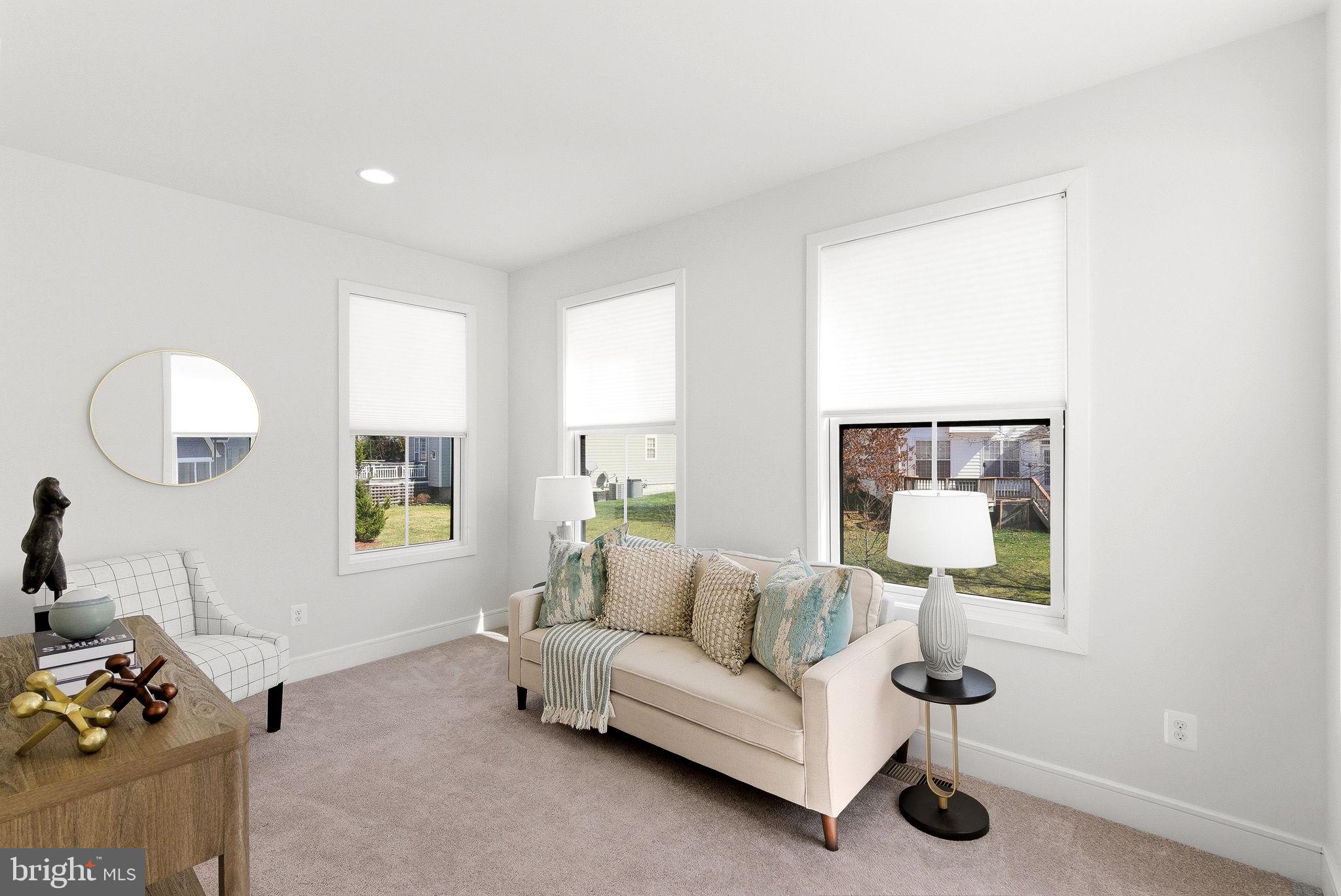 21340 Rainier Lane Broadlands, VA 20148 - Photo 30 of 62 a living room with furniture and a window