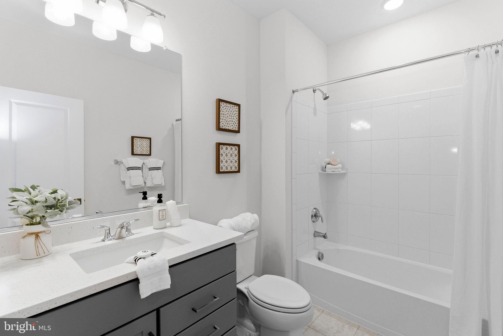 21340 Rainier Lane Broadlands, VA 20148 - Photo 36 of 62 a bathroom with a sink a toilet and shower