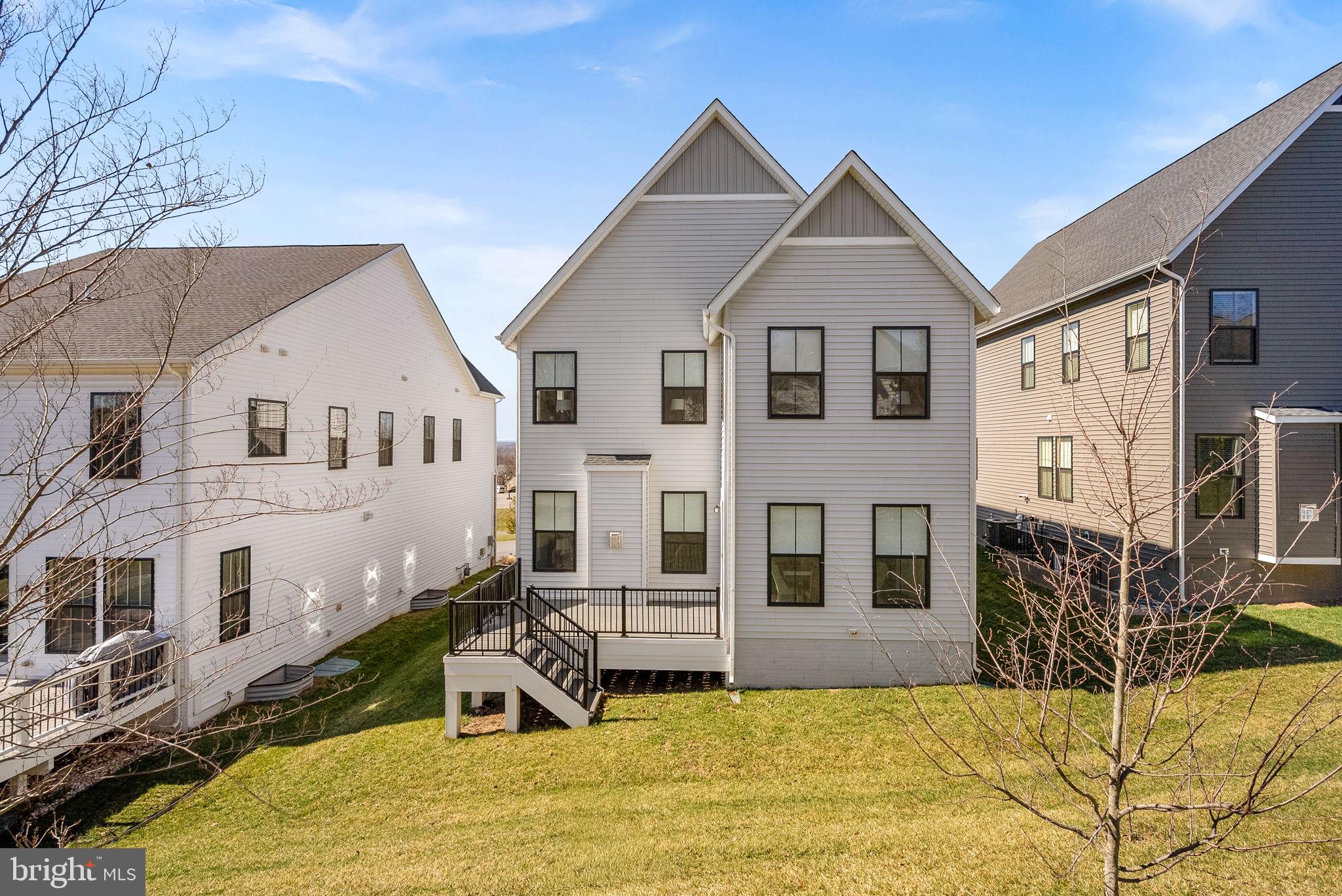 21340 Rainier Lane Broadlands, VA 20148 - Photo 46 of 62 a front view of a house with a yard
