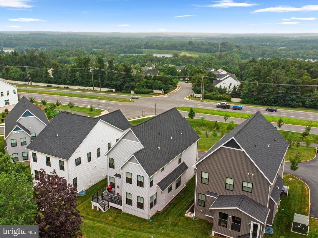 21340 Rainier Lane Broadlands, VA 20148 - Photo 49 of 62 an aerial view of a house with a garden and lake view