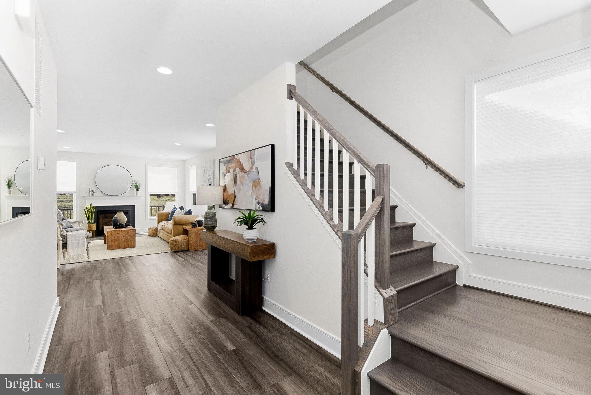 21340 Rainier Lane Broadlands, VA 20148 - Photo 5 of 62 a living room with furniture and a wooden floor