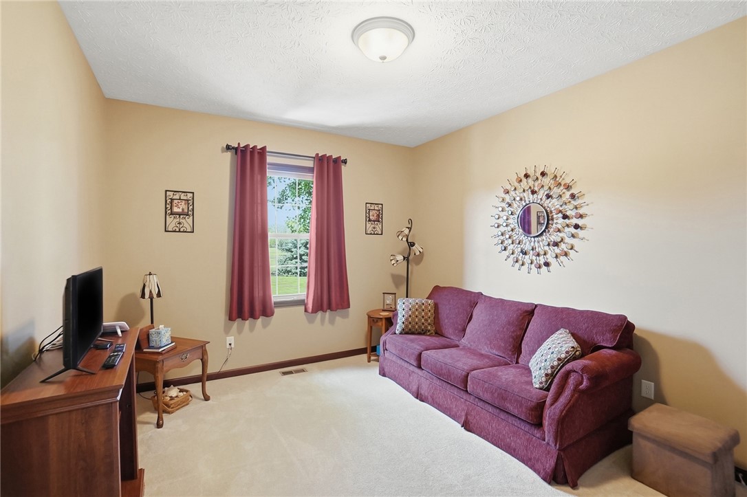 710 Governors Road Troy, OH 45373 - Photo 22 of 56 This bright room features abundant natural light, creating an inviting and comfortable living space.