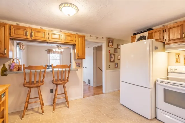 a white refrigerator freezer and a dishwasher in a kitchen