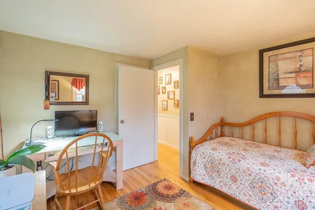 a bedroom with furniture and a window