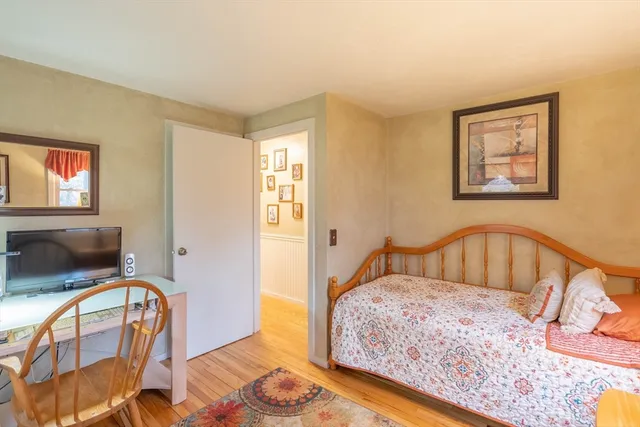 a bathroom with a sink a toilet and shower curtain
