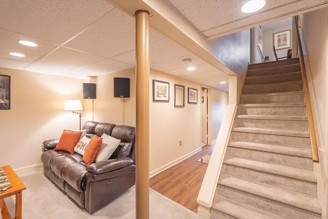 a view of a livingroom with furniture and an empty room