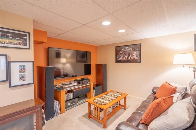 a bedroom with furniture and a flat screen tv
