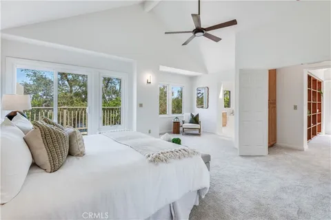 a spacious bathroom with a tub sink shower and mirror