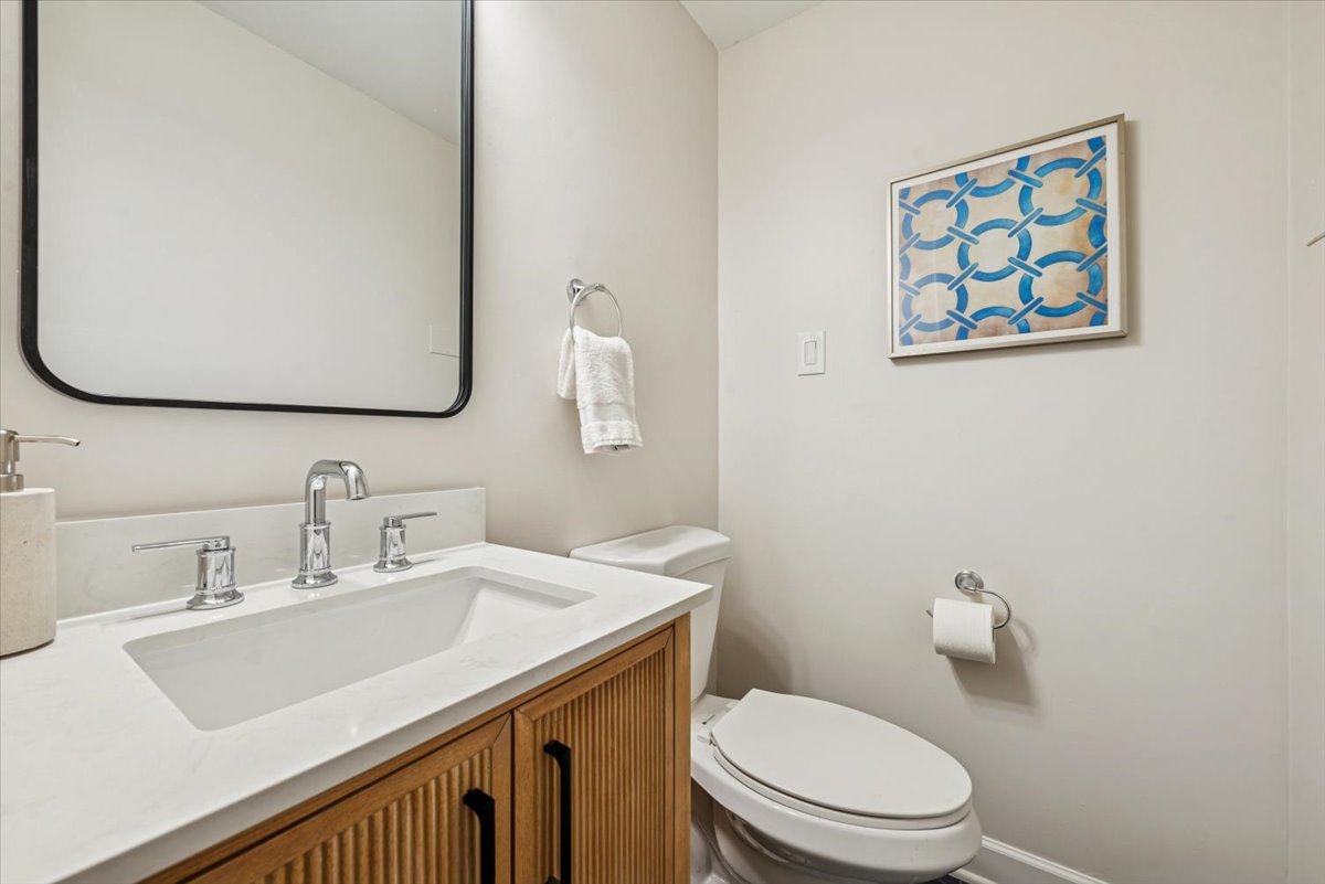 1024 West Byron Street, Unit G Chicago, IL 60613 - Photo 13 of 20 a bathroom with a sink mirror and toilet