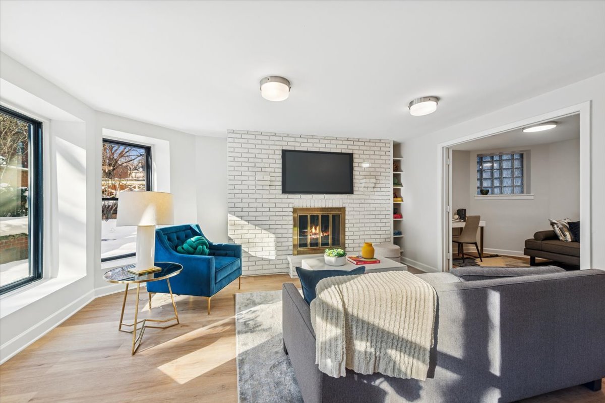 1024 West Byron Street, Unit G Chicago, IL 60613 - Photo 7 of 20 a living room with fireplace furniture and a flat screen tv
