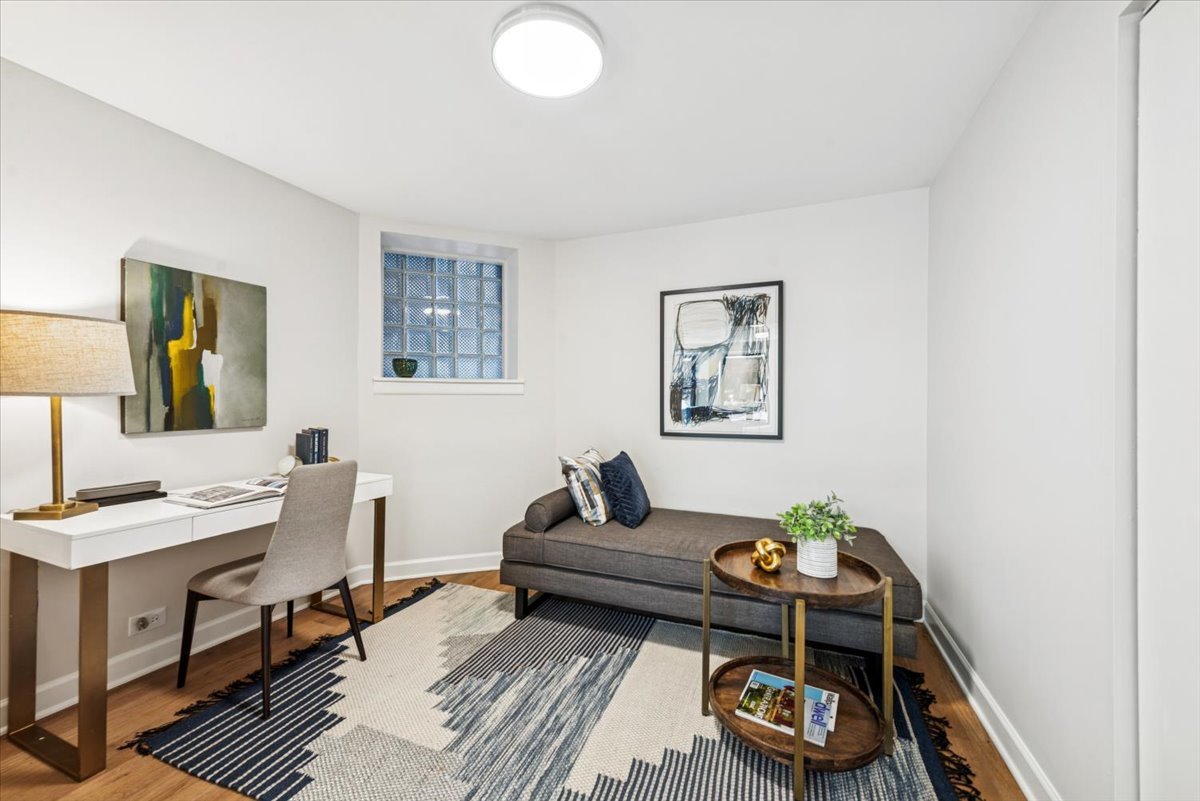 1024 West Byron Street, Unit G Chicago, IL 60613 - Photo 9 of 20 a living room with furniture and a wooden floor